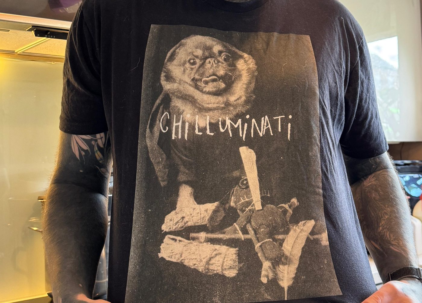 Ollie wearing the CHILLUMINATI t-shirt